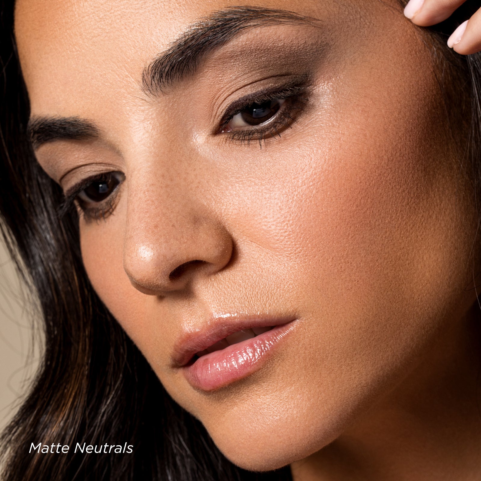 Close-up of a woman's face with a focus on makeup, labeled 'Matte Neutrals'.