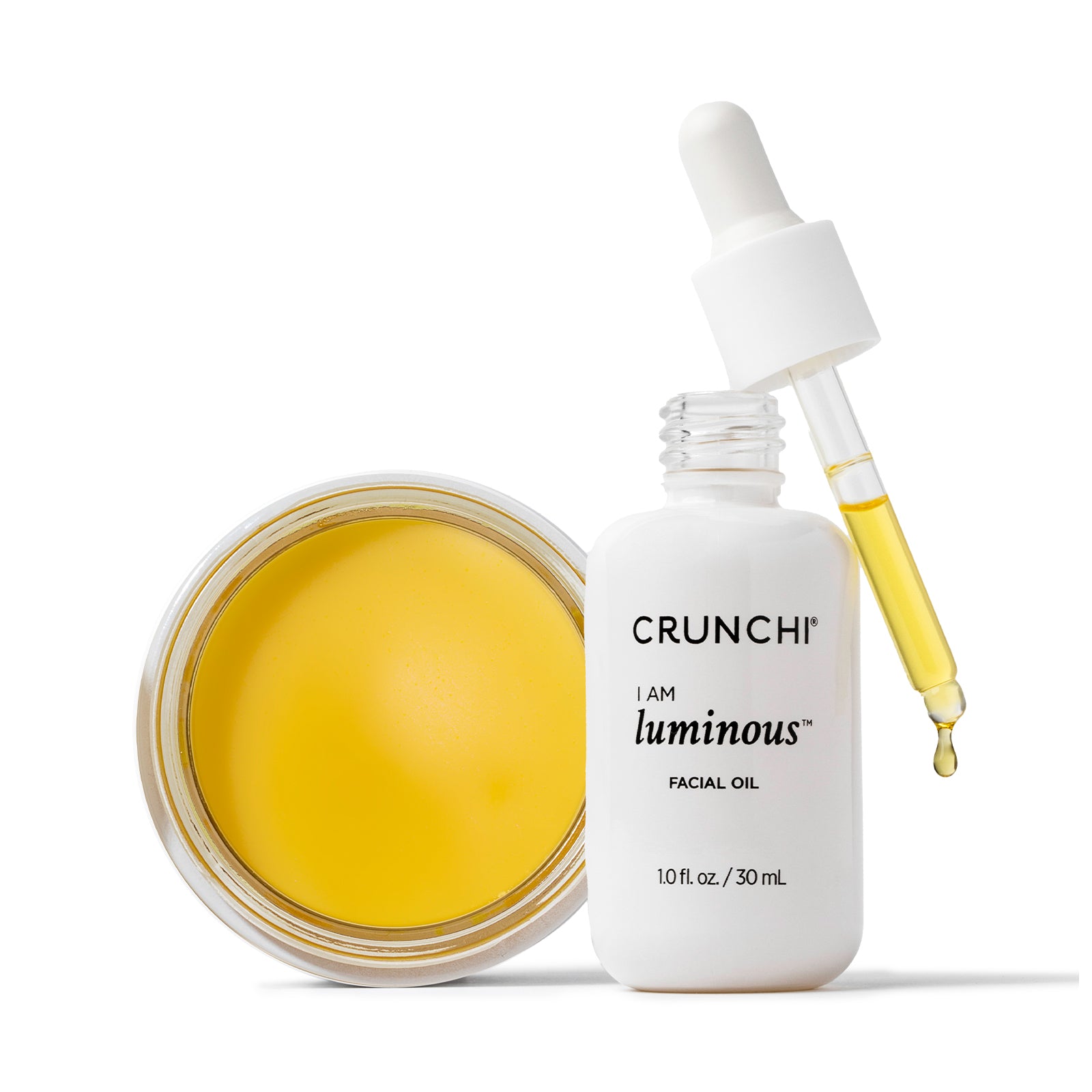 Facial oil jar and dropper bottle with 'CRUNCHI' branding on a white background