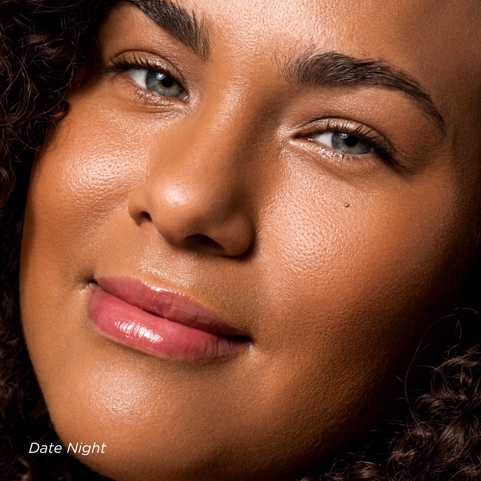 Close-up of a woman's face with a warm-toned filter