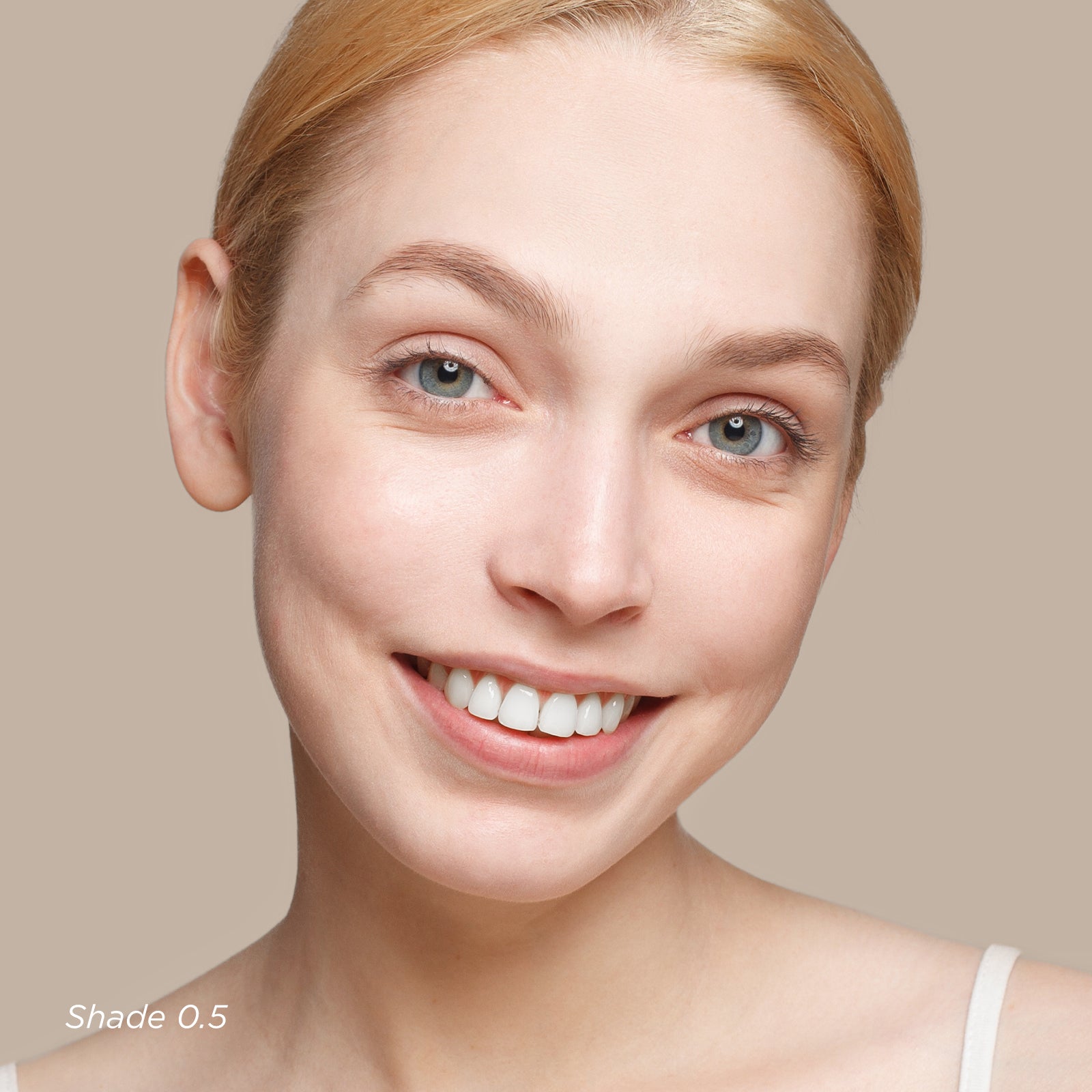 Close-up of a woman's face with a neutral background