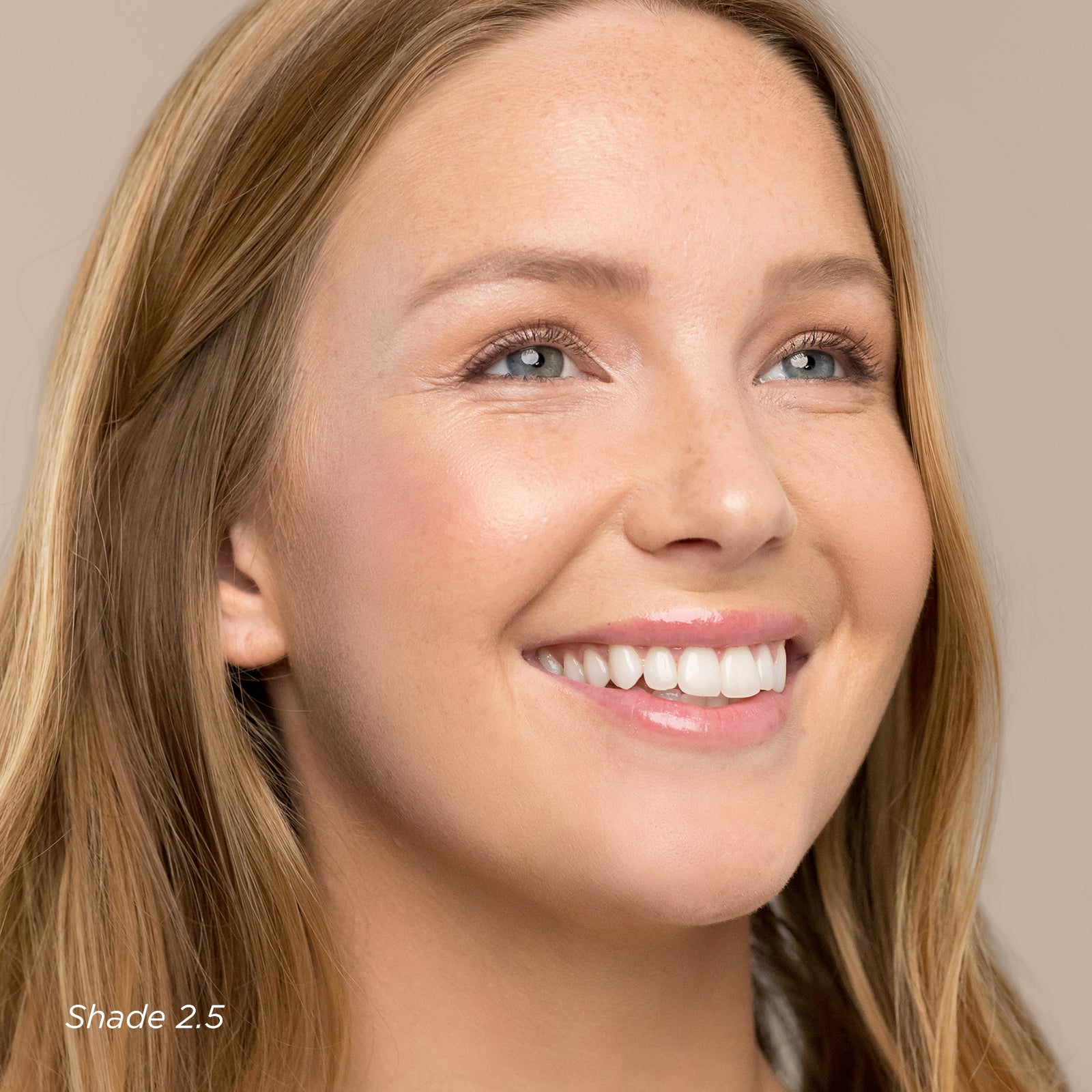 Close-up of a woman with a neutral background