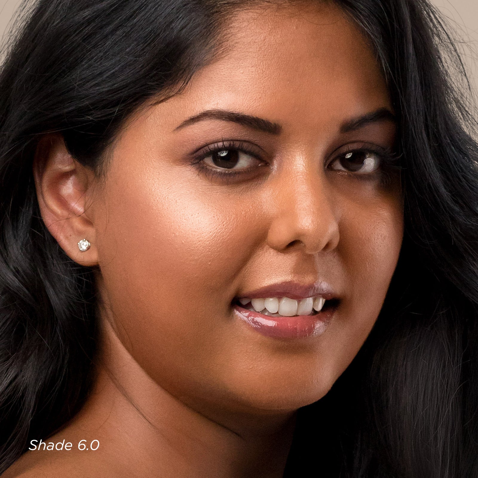 Close-up of a woman with dark hair and earrings, with 'Shade 6.0' text.