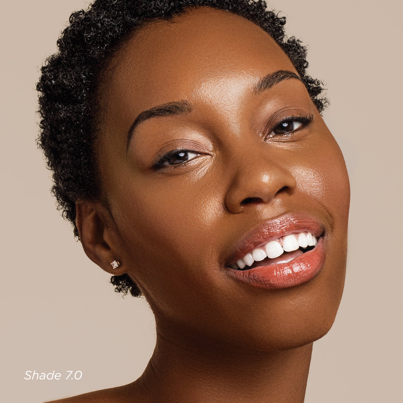 Close-up of a woman's face with a neutral background