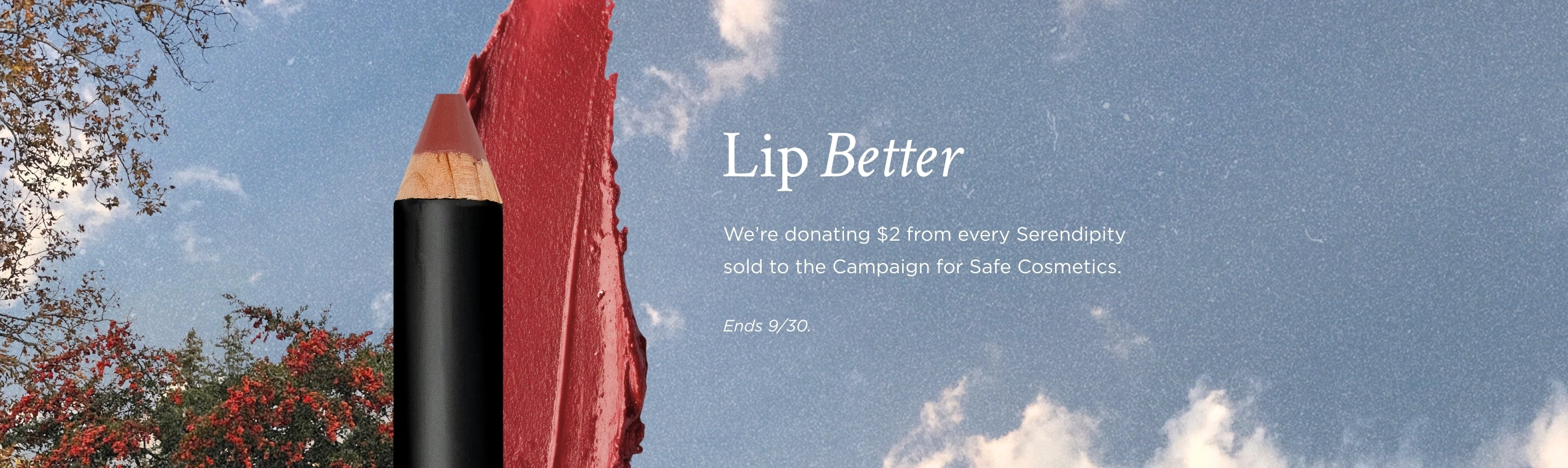 Lip balm with a red smear on a blue sky background