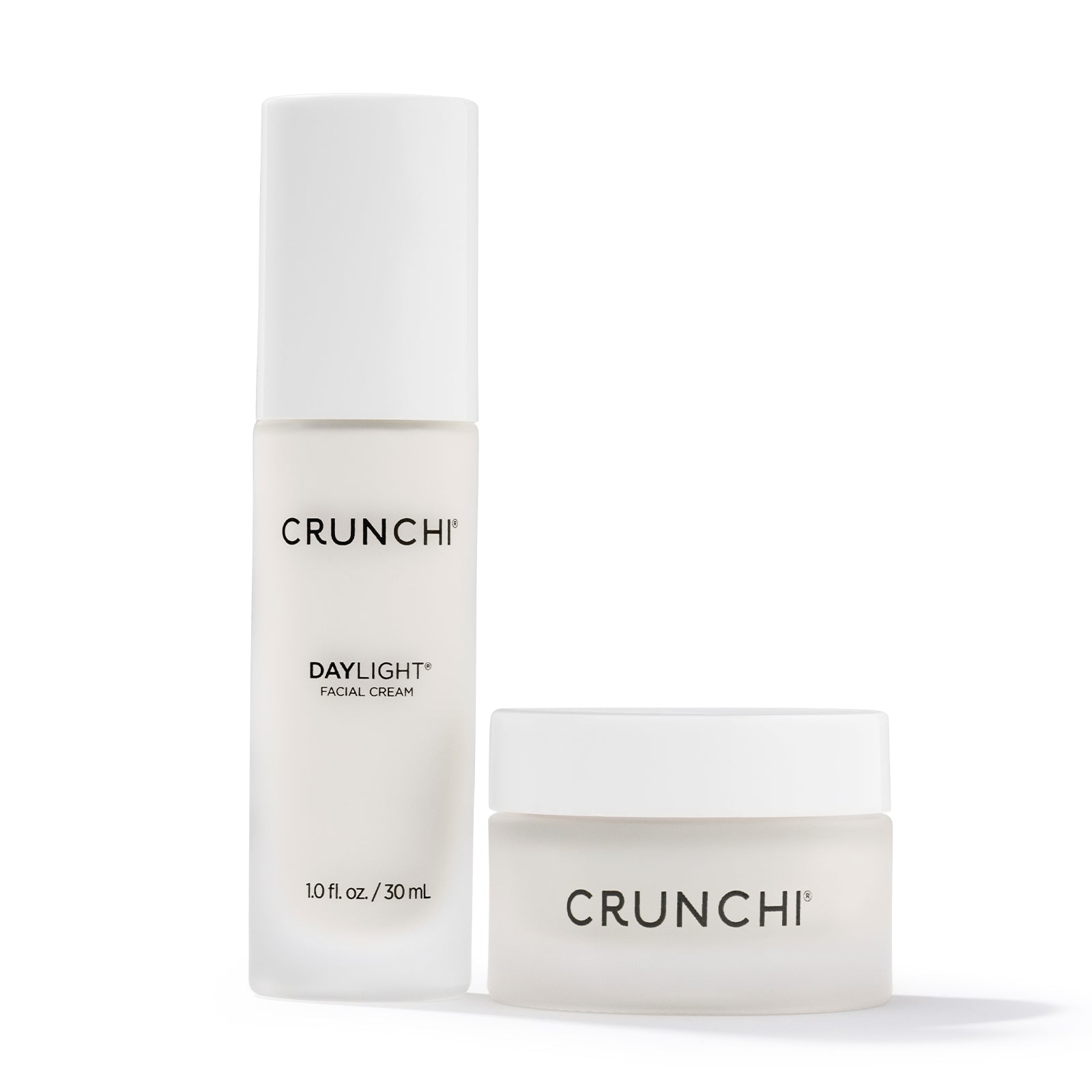 Two bottles of Crunchi Daylight Facial Cream on a white background