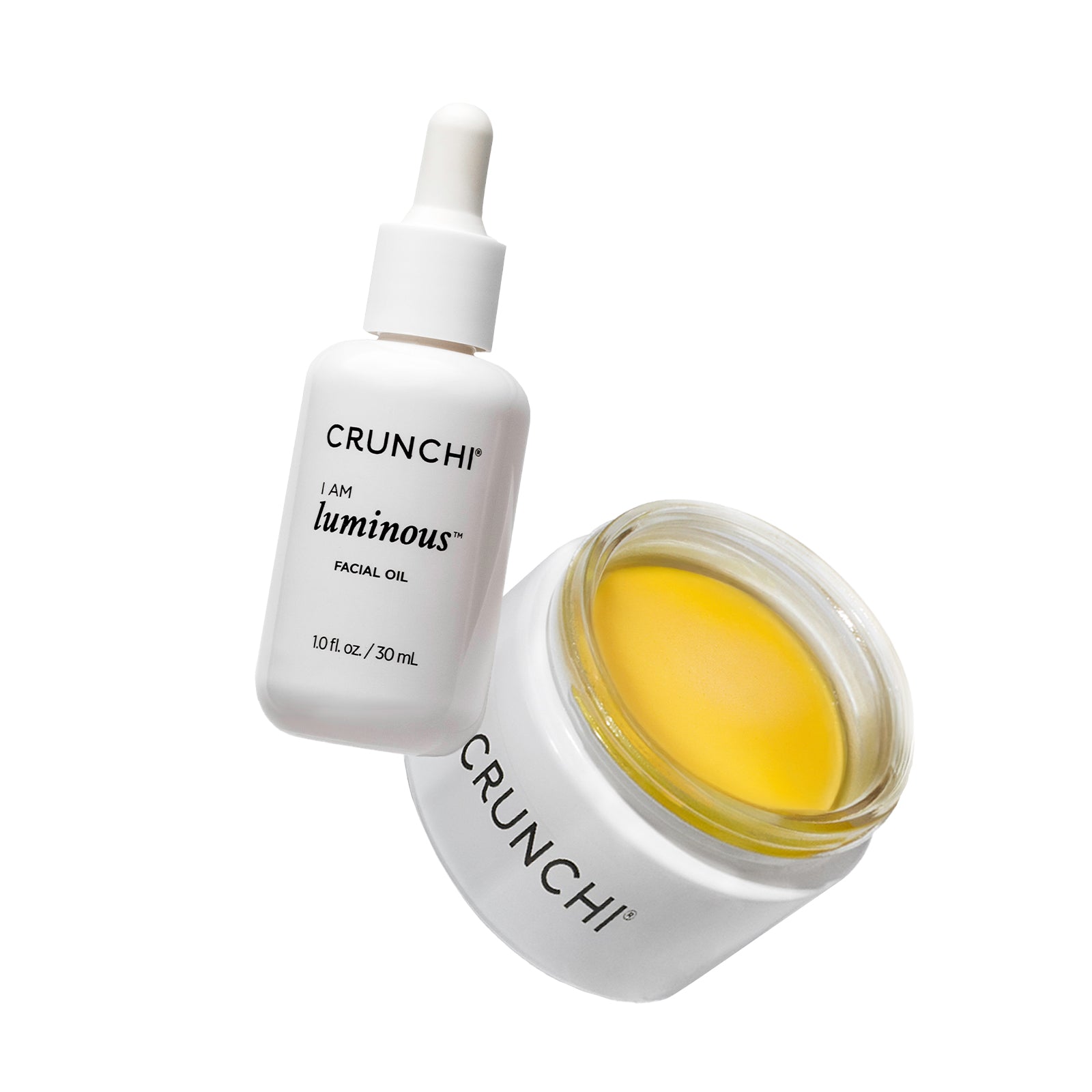 CRUNCHI facial oil bottle and jar on a white background