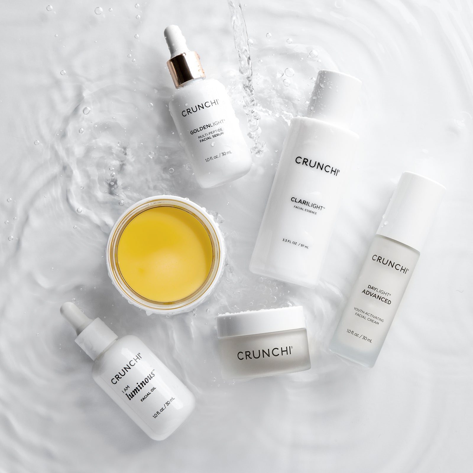 CRUNCHI skincare products on a textured white background