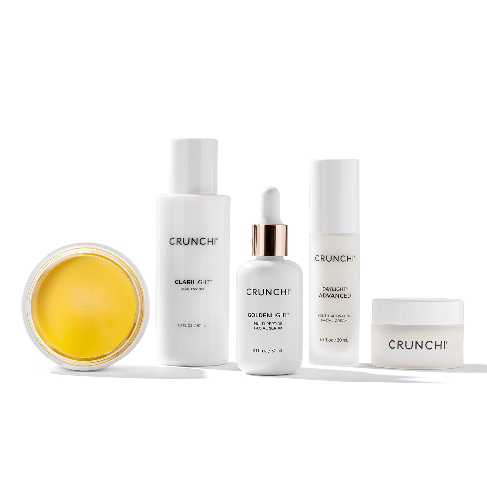 Collection of Crunchi skincare products on a white background