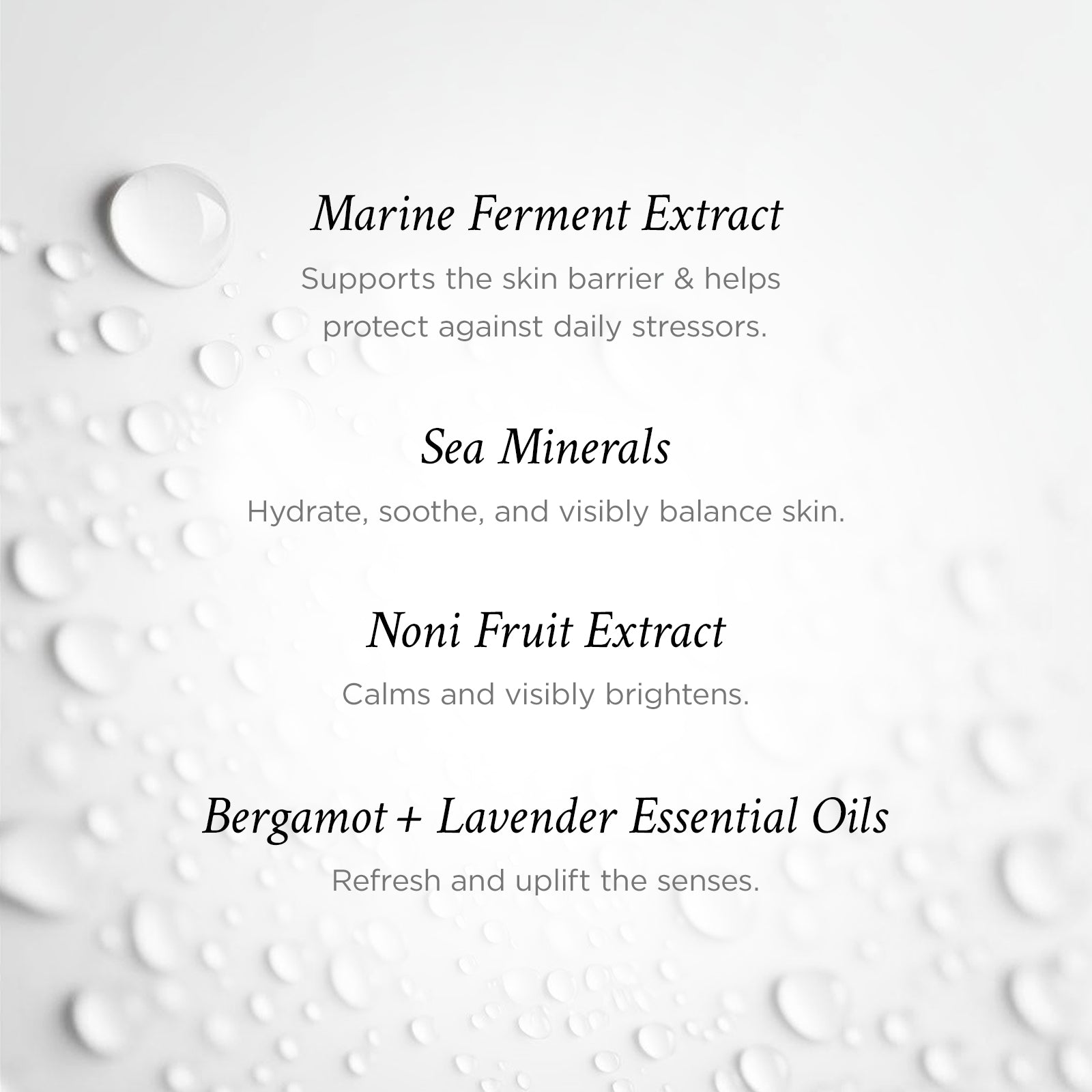 Text detailing the benefits of Marine Ferment Extract, Sea Minerals, Noni Fruit Extract, and Bergamot + Lavender Essential Oils on a white background with water droplets.
