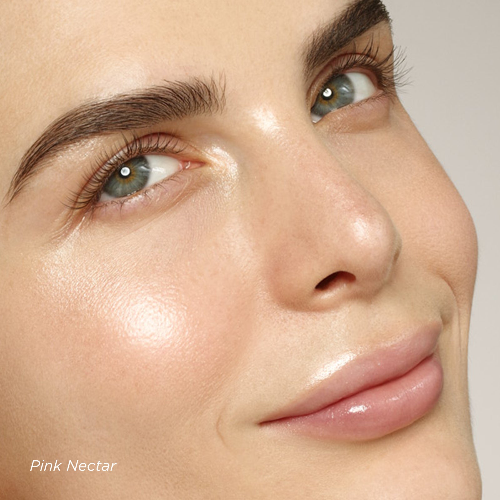 Close-up of a woman's face with 'Pink Nectar' text